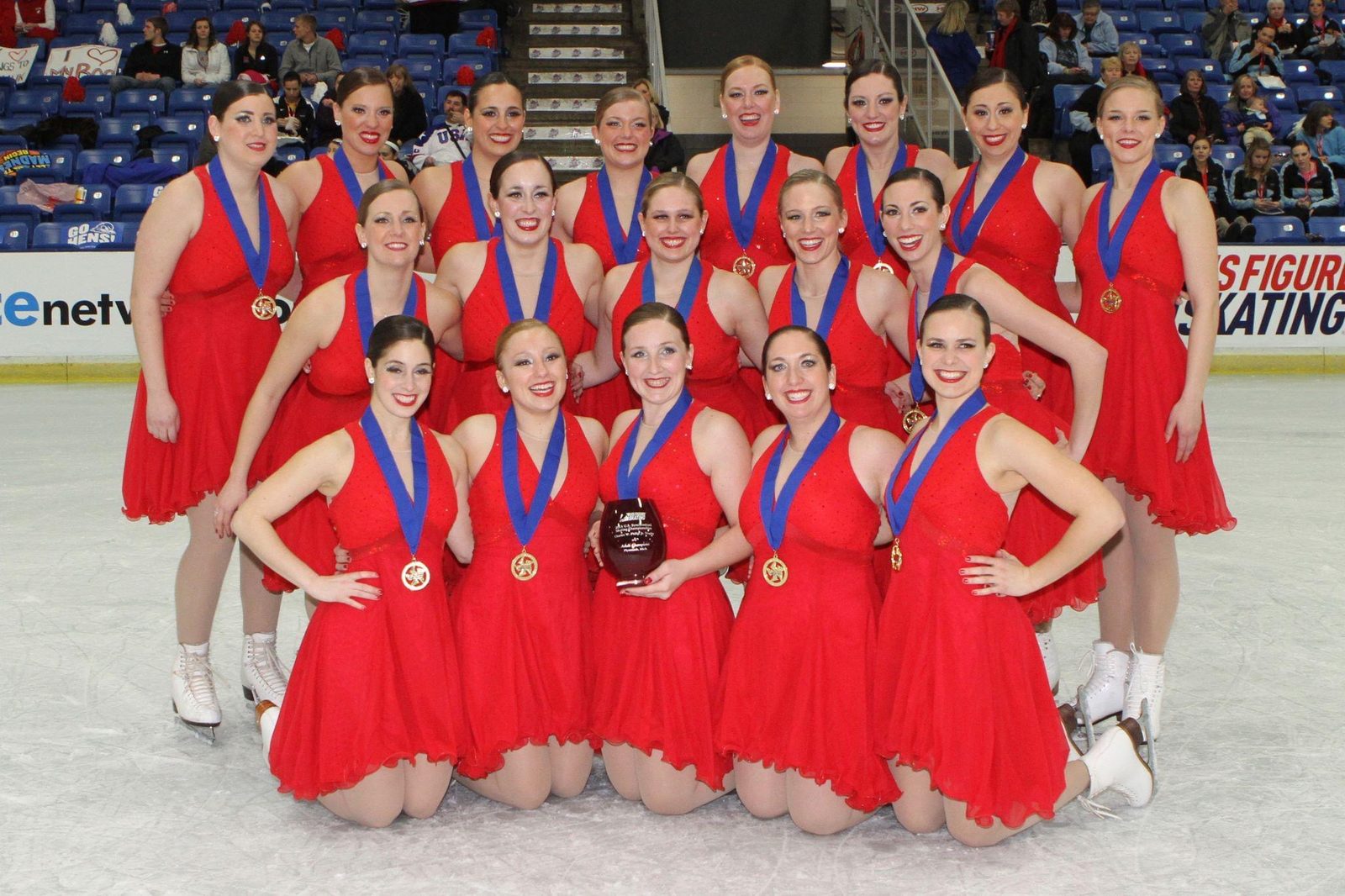 Haydenettes Synchronized Skating — U.S. National Champions, red competition dresses with gold medals and trophy